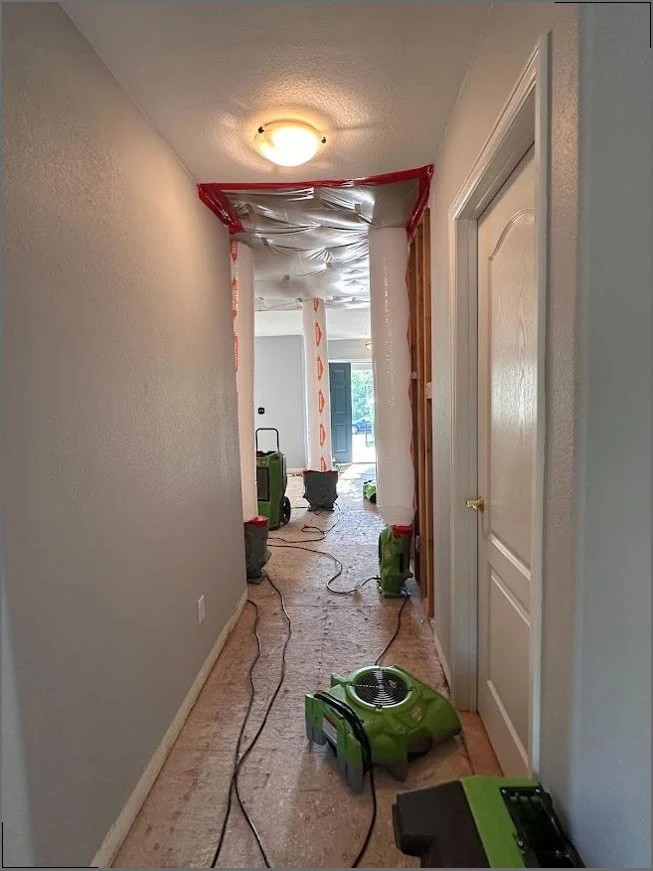 Commercial air movers drying a Norwalk home after water damage